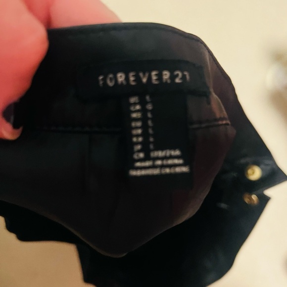 Faux leather Forever21 mini skirt in large with metal embellishments - Picture 3 of 4